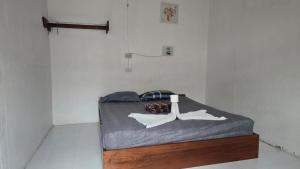 a small bedroom with a bed in a room at Sunny hostel garden in Pai +6 photos
