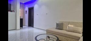 a living room with a couch with pillows on it at Thiam APPART in Nouakchott