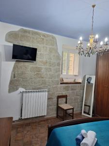 TV a/nebo společenská místnost v ubytování La casa dei Nonni