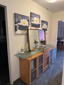 a dressing table with a mirror on top of it at Meri 2 in Ostermundigen
