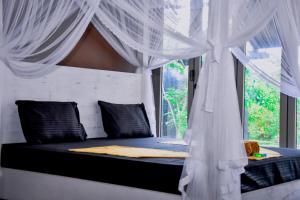 Ένα ή περισσότερα κρεβάτια σε δωμάτιο στο Elite Black Villa
