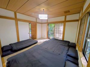 Ένα ή περισσότερα κρεβάτια σε δωμάτιο στο Nasu Central Private Villa