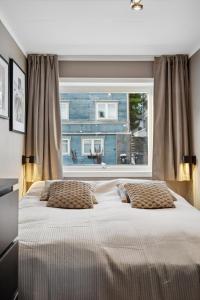 Ένα ή περισσότερα κρεβάτια σε δωμάτιο στο The Reindeer Lounge, Nordic Comfort in the Arctic