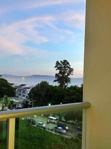 a balcony with a view of a parking lot at Sands Condo Pattaya-Seaview by the Beach in Pattaya South
