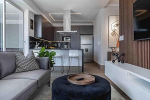 a living room with a couch and a table at ®{LUX~City~Skyline} @DowntownSD PrivéJaccuziGym in La Julia