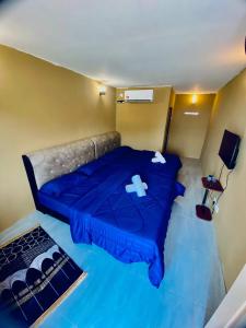 Postel nebo postele na pokoji v ubytování D'Khaira Villa