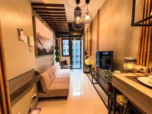 TV a/nebo společenská místnost v ubytování The Amani Suite SHORE 3 B02-1105