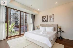 Ένα ή περισσότερα κρεβάτια σε δωμάτιο στο The Royal Metropole Saigon Suite +100 φωτογραφίες