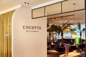 a restaurant with a sign that reads colectric restaurant at Van der Valk Hotel Gent in Ghent