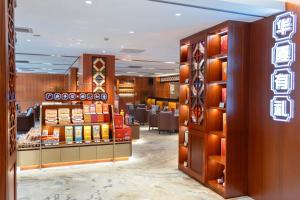 a store with a lot of products on display at Hotel Landmark Canton in Guangzhou