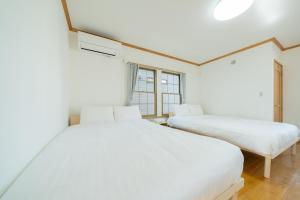 Postel nebo postele na pokoji v ubytování Asahimachi House + 21 fotografií