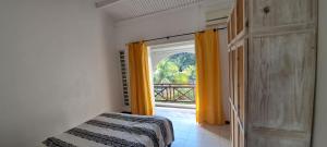 a bedroom with a bed and a window with a view at Kenville in Cap Malheureux +62 photos