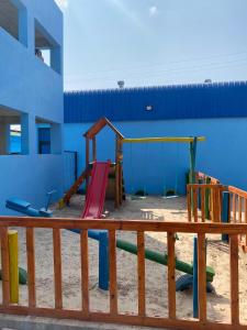 a playground on the beach next to a building at Villa Djonasse, a Residence of Exellency in Fombeni +2 photos