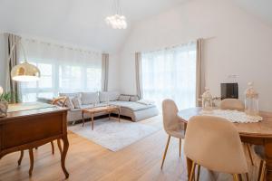 a living room with a table and a couch at Ferienwohnungen St Marien in Gengenbach