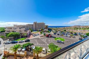 a view of a parking lot from a balcony at Golf del Sur Parque Albatros 417 in San Miguel de Abona