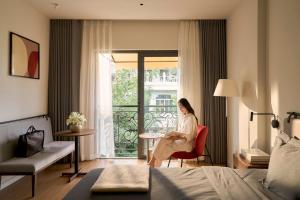 Posezení v ubytování Express by M Village Nguyen The Loc - Modern Airport Stay