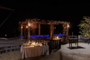 a set up for a wedding reception at night at Garonga Safari in Makalali Game Reserve +150 photos