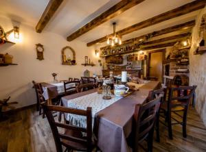 a dining room with a long table and chairs at Apartments Scerbe Gordana & Miljenko Rab in Otok Rab