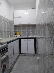 Kuchyň nebo kuchyňský kout v ubytování Nice apartment in Menzah 5 + 1 fotografie