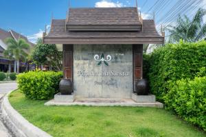 a sign at the front of a resort at Phuket La Siesta, Naiharn Beach in Nai Harn Beach