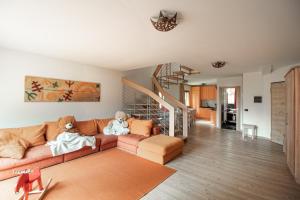 two teddy bears sitting on a couch in a living room at CAMPIGLIO Panorama sul Brenta in Madonna di Campiglio