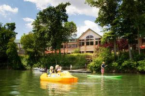 a group of people on boats in the water at Stonewall Resort in Roanoke