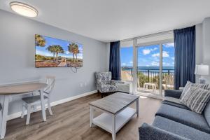 a living room with a couch and a table at Boardwalk Resort 233 in Myrtle Beach