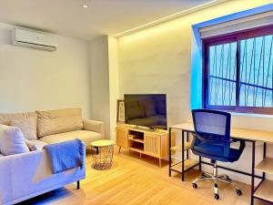 Μια τηλεόραση ή/και κέντρο ψυχαγωγίας στο Casa Carbonera By Gloove