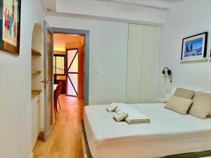 Ένα ή περισσότερα κρεβάτια σε δωμάτιο στο Casa Carbonera By Gloove