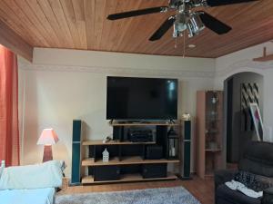 a living room with a flat screen tv at NorthSlope in Rovaniemi