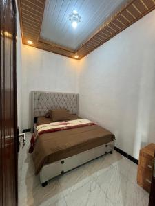 Postel nebo postele na pokoji v ubytování Homestay Castanea