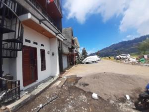 a view of a building with a driveway at Homestay Castanea in Diyeng