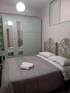 a bedroom with a bed with a towel on it at SA HOUSE in Barletta