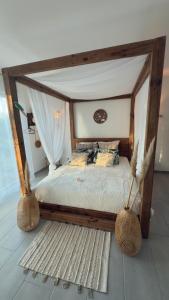 En eller flere senge i et værelse på Le Second Paradis