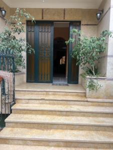 a set of stairs leading to a door of a house at Villa nuira in Inezgane