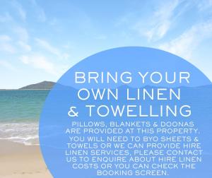 a sign on a beach with the words bring your own linen and tourism at Villa Delfini Pet Friendly in Hawks Nest