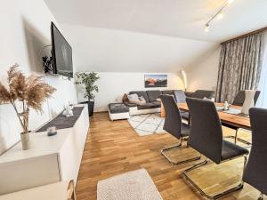 a living room with a couch and a table at Apartment Ferienwohnung Monika by Interhome in Öblarn