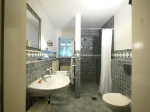 a bathroom with a sink and a toilet at Teichblick in Trebel +37 photos