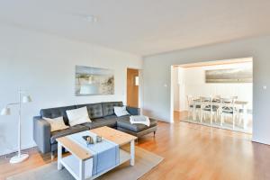 a living room with a couch and a table at Ferienhaus Heideweg in Zingst