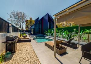 a backyard with a swimming pool and a house at Sunshine Villa in Atakum