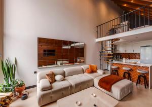 a living room with a couch and a kitchen at Sunshine Villa in Atakum