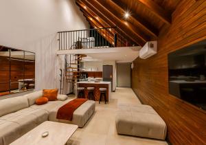 a living room with a couch and a table at Sunshine Villa in Atakum