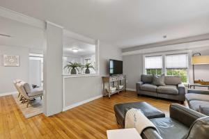 a living room with a couch and a table at Post & Beam - SHARED 4 Bedroom 1 Bath Home On Pond - Shared 4 Bedrooms Available in Bradford