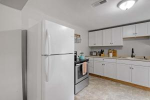 a kitchen with white cabinets and a white refrigerator at Post & Beam - SHARED 4 Bedroom 1 Bath Home On Pond - Shared 4 Bedrooms Available in Bradford +45 photos