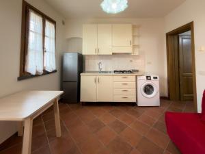 Kuchyň nebo kuchyňský kout v ubytování Affittacamere Il Girasole