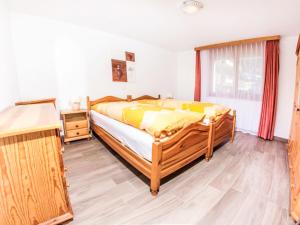 Ένα ή περισσότερα κρεβάτια σε δωμάτιο στο Apartment Metropol B by Interhome