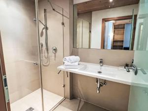 a bathroom with a sink and a shower at Apartment Cheeky Apartment-6 by Interhome in Oberndorf in Tirol