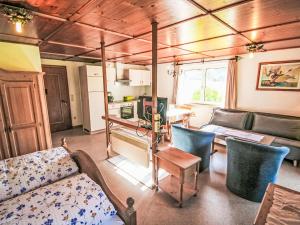 a living room with a couch and a table at Apartment Kombi-Objekt Studio Biara und Grenta by Interhome in Gortipohl +16 photos