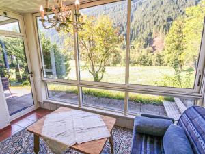 a room with a large window with a table and chairs at Apartment Kombi-Objekt Studio Biara und Grenta by Interhome in Gortipohl