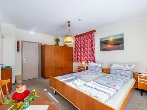 a bedroom with a large bed in a room at Holiday Home Elisabeth by Interhome in Mallnitz